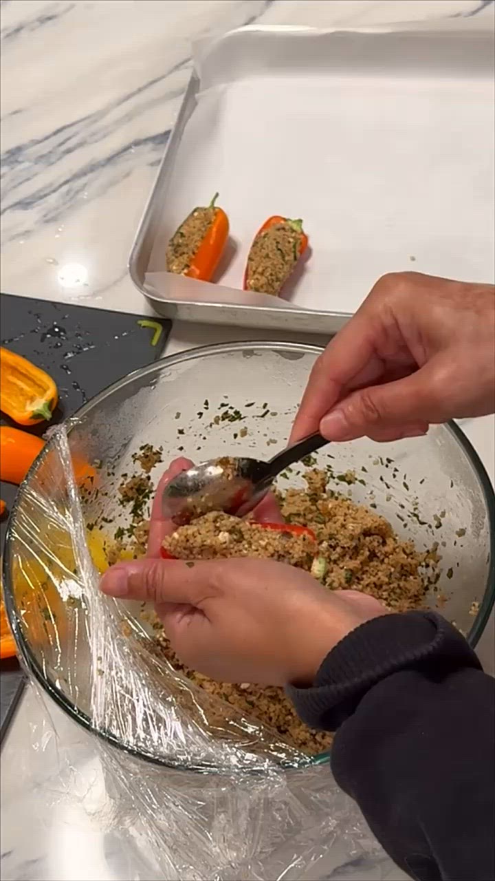 A picture of step 5 of Stuffed baby peppers with date couscous and feta.
