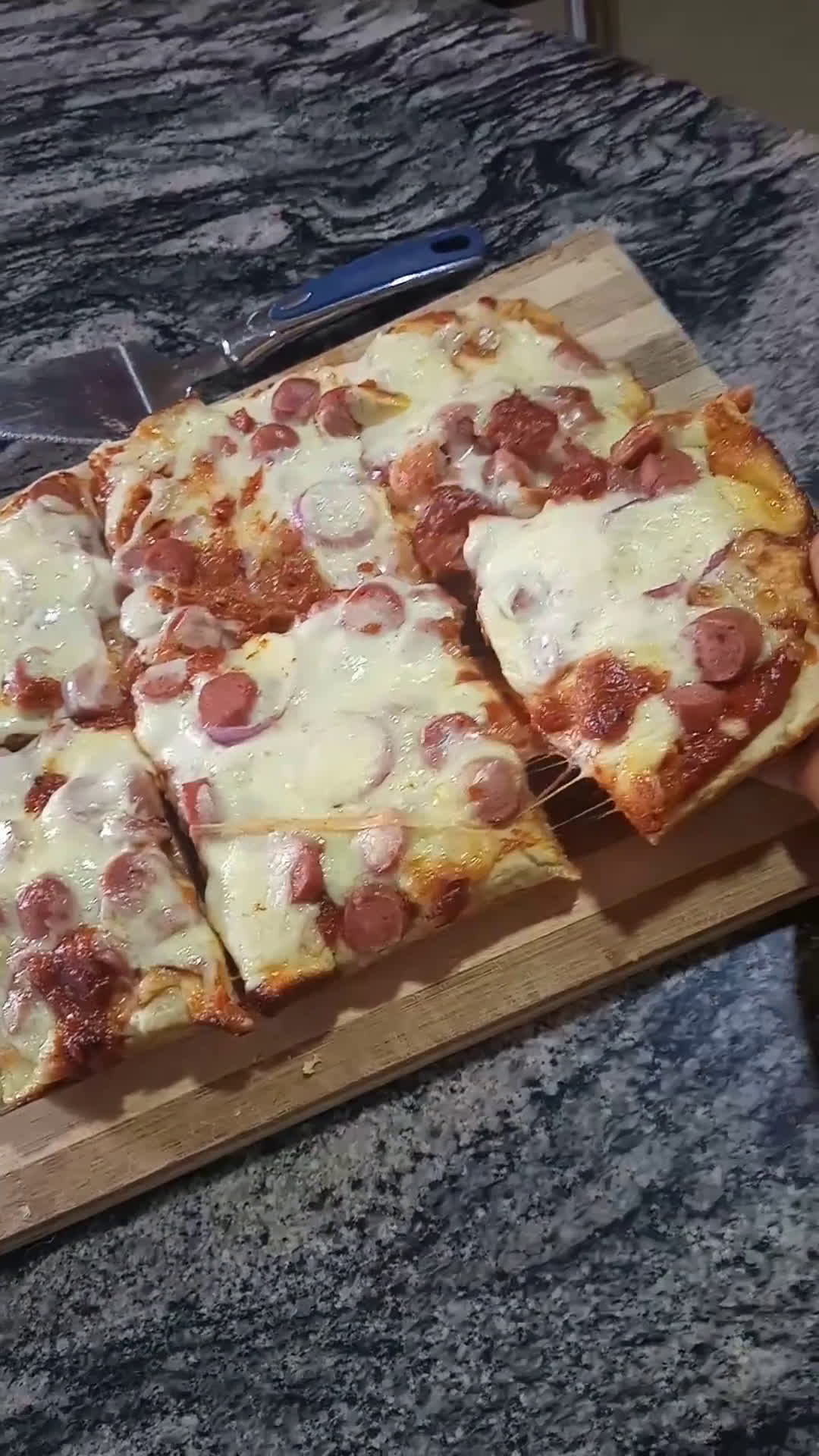 A picture of step 7 of Mozeralla and sausage Pizza.