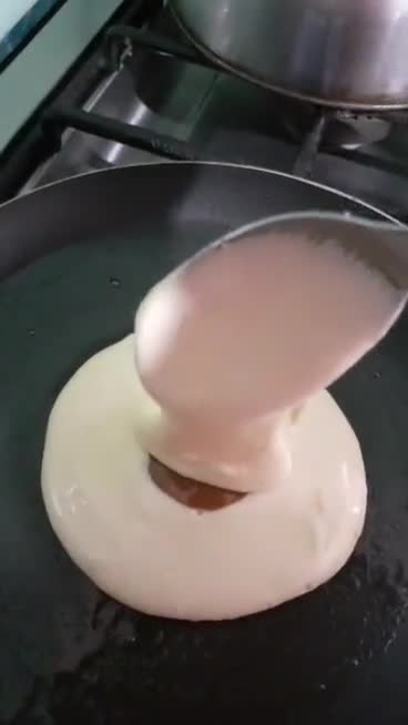 Foto del paso 3 de la receta: Hotcakes de naranja rellenos con dulce de leche🤤