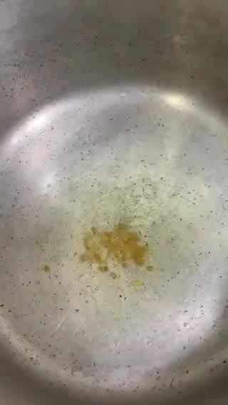 A picture of step 2 of Sweet and sour Tomato Curry serve with white rice.