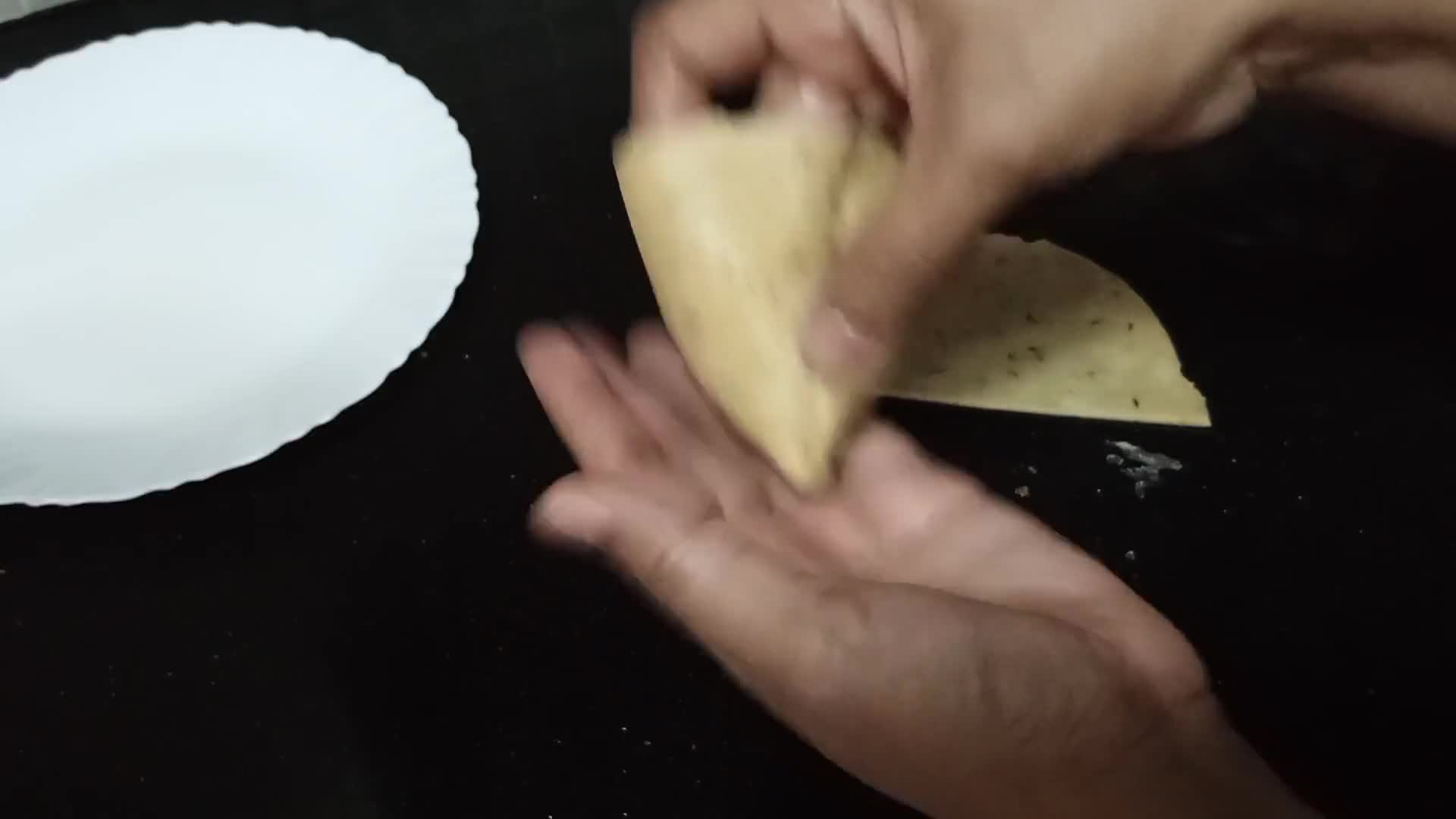A picture of step 11 of Aloo Ke samosay.