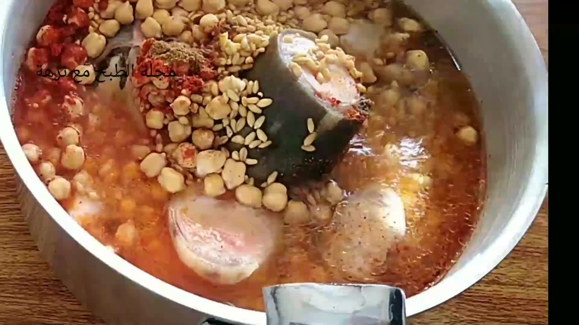 صورة لخطوة 2 من وصفة كرعين بالحمص والقمح