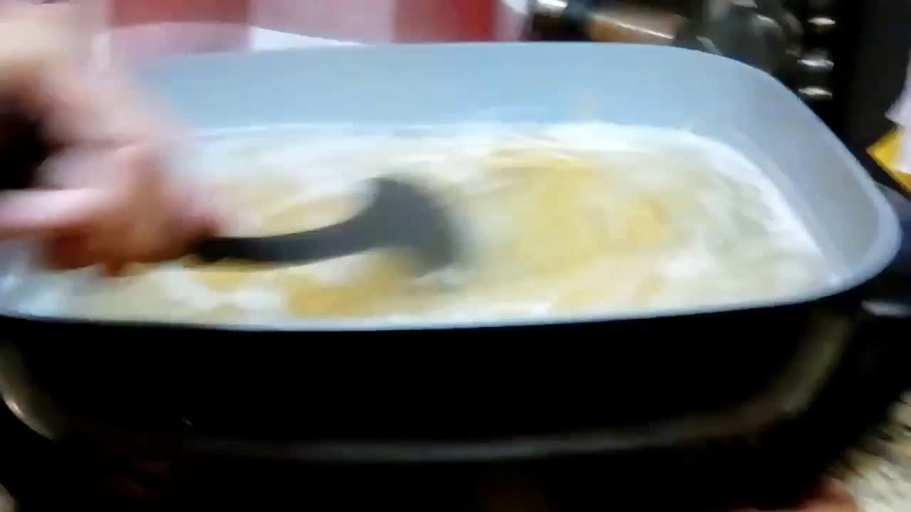 A picture of step 14 of Chicken Parmesan With Spaghetti and Garlic Bread.