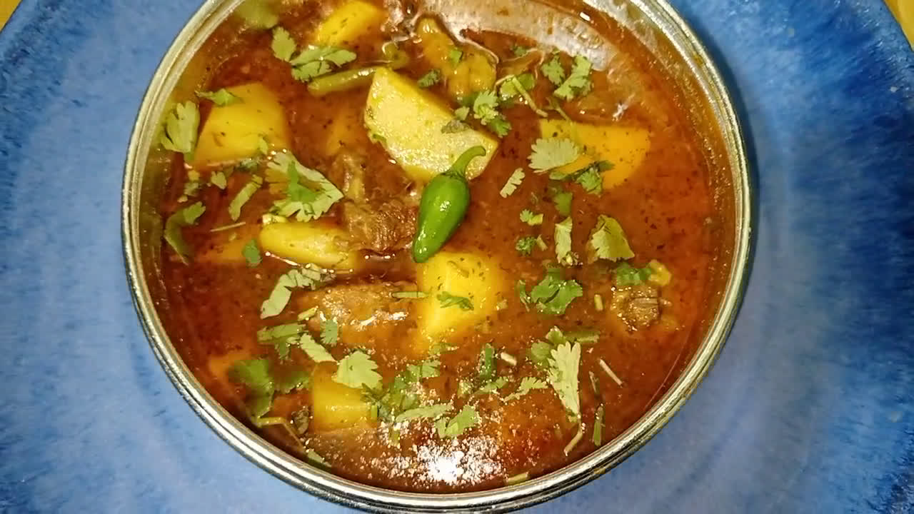 A picture of step 4 of 3 color aloo gosht.