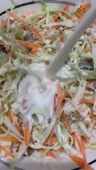 A picture of step 3 of Coleslaw with raisins.