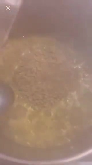 A picture of step 4 of Marju Qelie (lentil and meat stew).