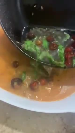 A picture of step 12 of Sweet and sour Tomato Curry serve with white rice.