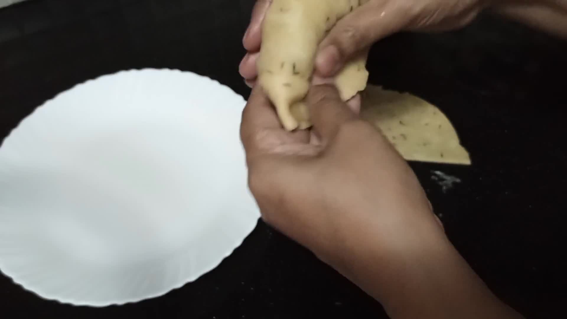 A picture of step 11 of Aloo Ke samosay.