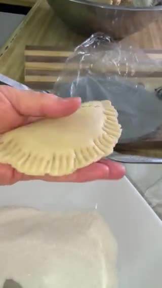 A picture of step 4 of Empanadas with Cola.