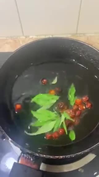 A picture of step 12 of Sweet and sour Tomato Curry serve with white rice.