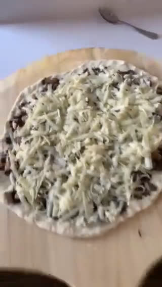 A picture of step 7 of Truffled Fontina and Mushroom Pizza.