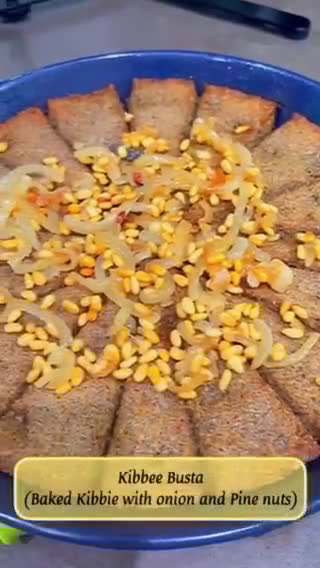 A picture of step 12 of Kibbee Busta (Baked Kibbee with onion and pine nuts).