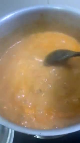 A picture of step 10 of Sweet and sour Tomato Curry serve with white rice.