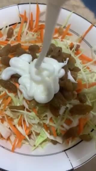 A picture of step 2 of Coleslaw with raisins.