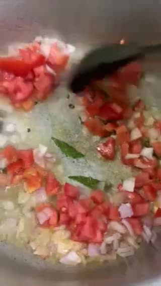 A picture of step 3 of Sweet and sour Tomato Curry serve with white rice.