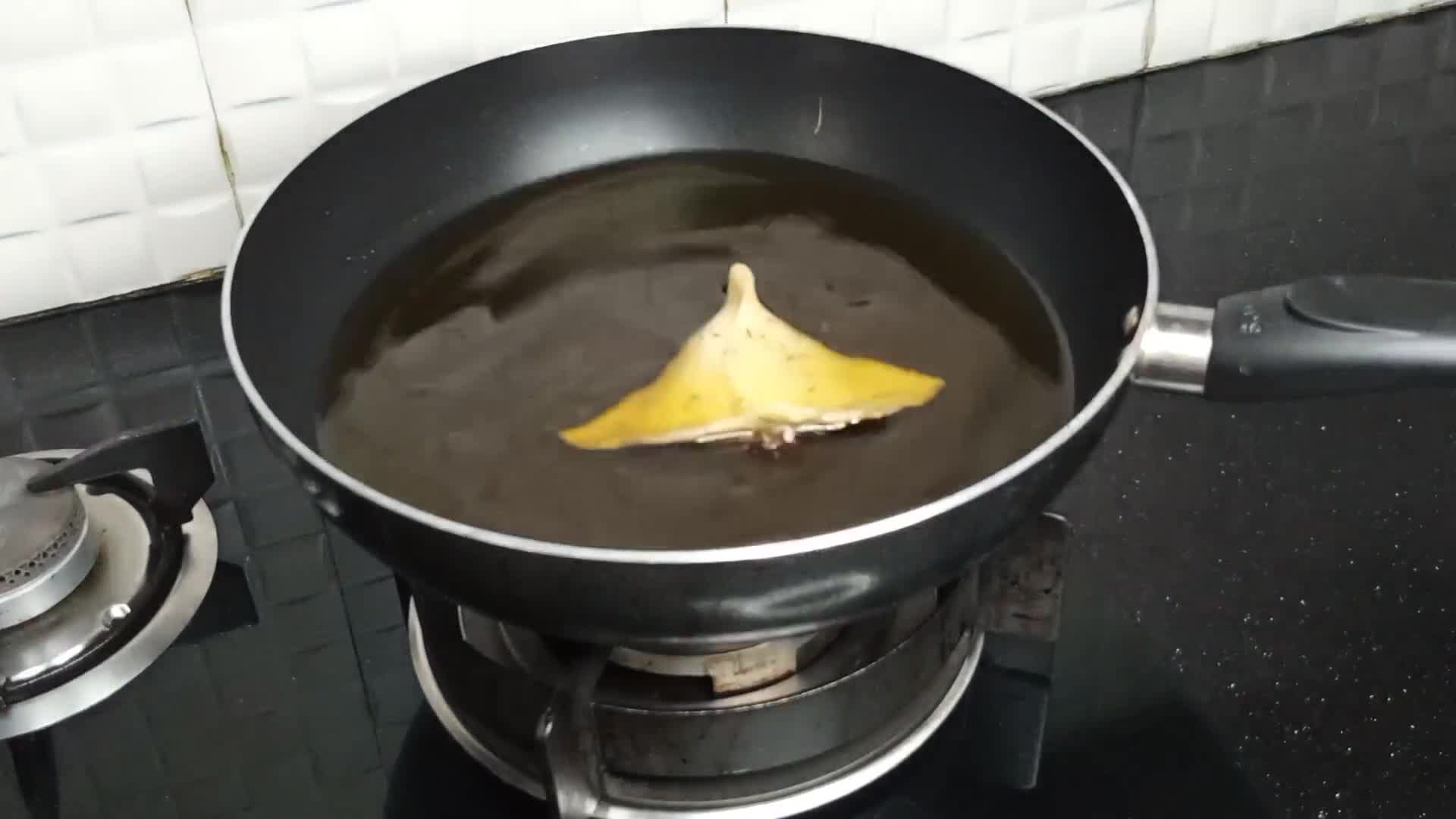 A picture of step 12 of Aloo Ke samosay.