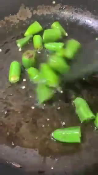 A picture of step 1 of Fried green chillies.