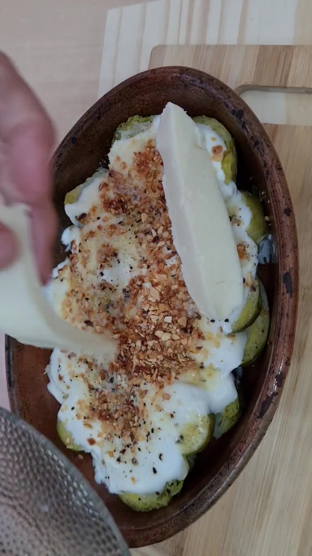 Foto del paso 4 de la receta: Repollitos de Bruselas en yogur, sobre base de avena y gratinados con queso