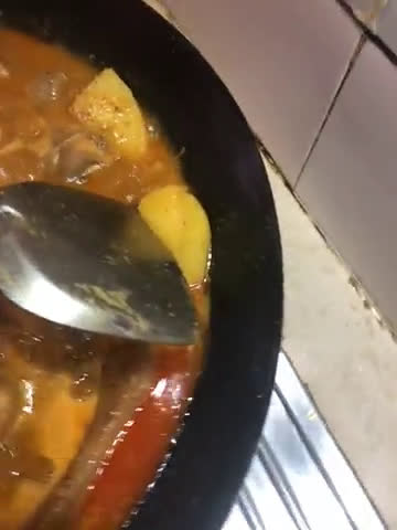 A picture of step 11 of Masala Chicken Curry with Potatoes.
