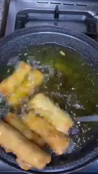 A picture of step 11 of Chicken vegetable spring rolls.