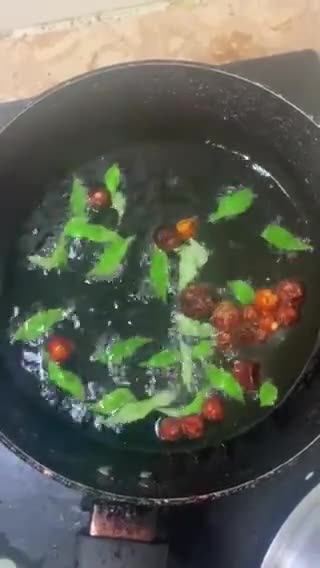 A picture of step 12 of Sweet and sour Tomato Curry serve with white rice.