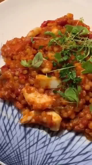 A picture of step 8 of Fregola sarda with prawns, squid, scallops, blue eye cod and light tomato sauce.