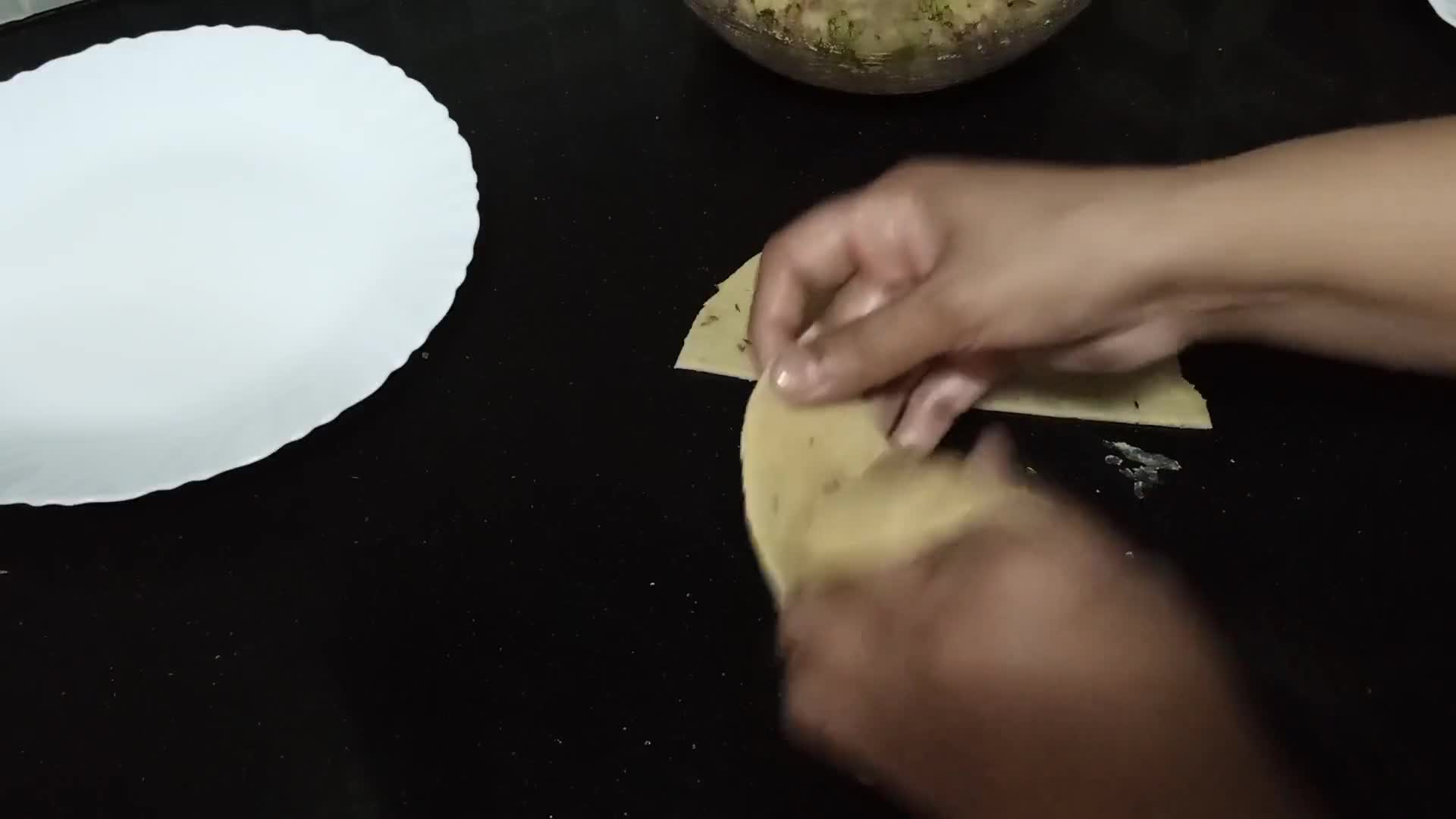 A picture of step 10 of Aloo Ke samosay.