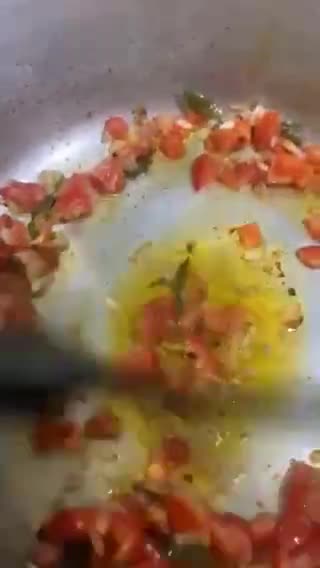 A picture of step 7 of Sweet and sour Tomato Curry serve with white rice.