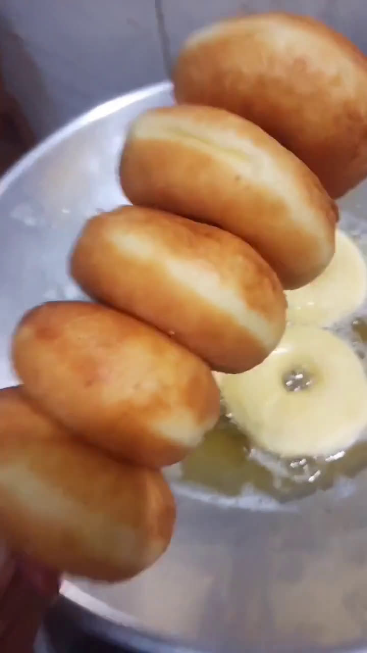 A picture of step 6 of Soft Potato Donuts.