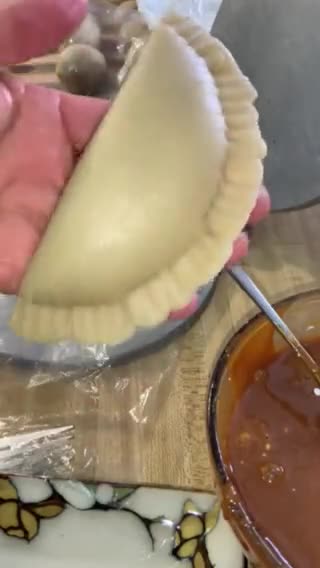 A picture of step 4 of Empanadas with Cola.