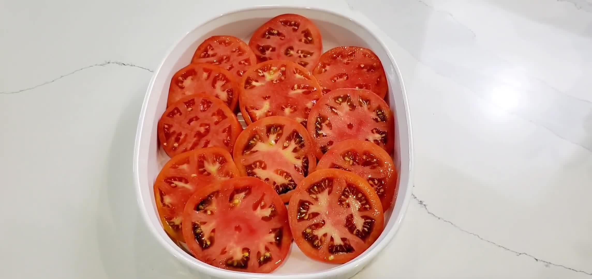 A picture of step 2 of Grilled Tomatoes with cheese.