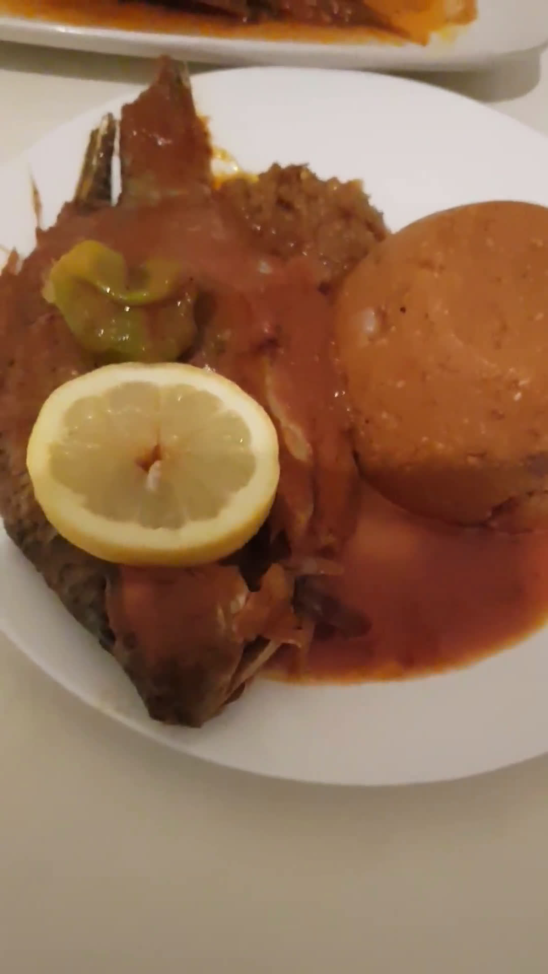 Red Eba and tilapia fish stew (PINON)matakin girki12 hoto