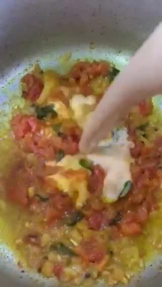 A picture of step 8 of Sweet and sour Tomato Curry serve with white rice.