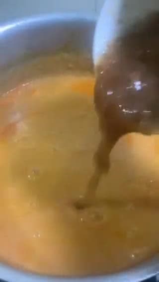 A picture of step 10 of Sweet and sour Tomato Curry serve with white rice.